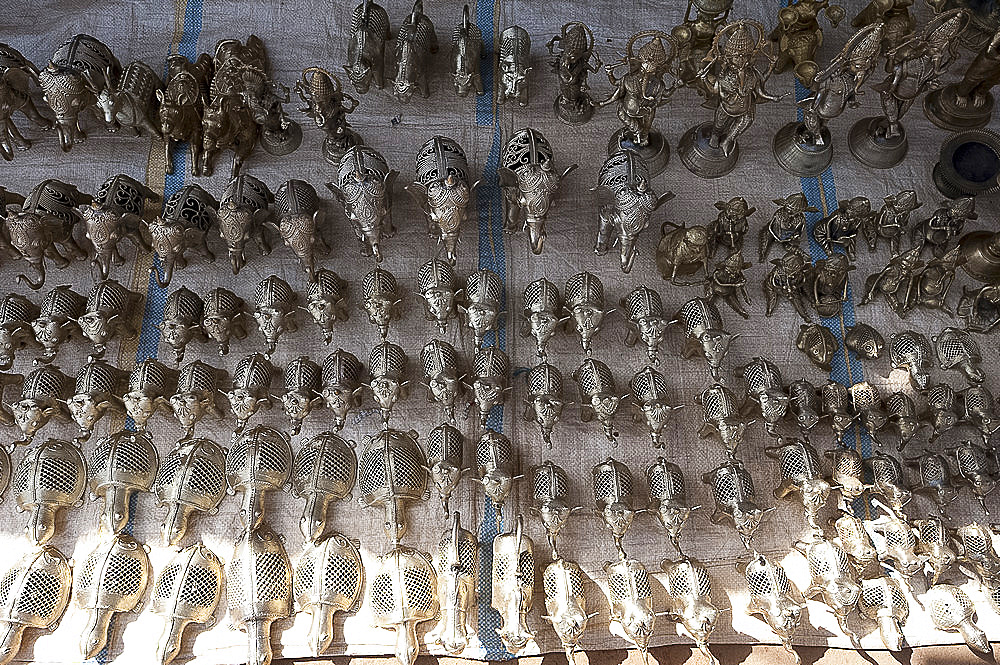 Small brass animals made by the lost wax method in untouchable brassmaking village, rural Orissa, India, Asia