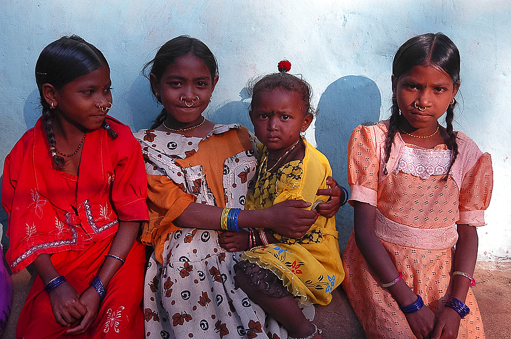 Four tribal girls, three with nose rings, in Mali tribal village, Jeypore district, Orissa, India, Asia