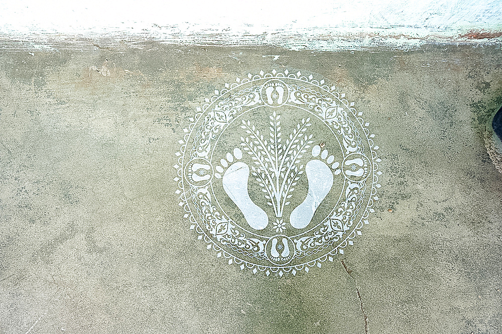 Hindu pattern indicating welcome into house, on wall, Naupatana weaving village, rural Orissa, India, Asia