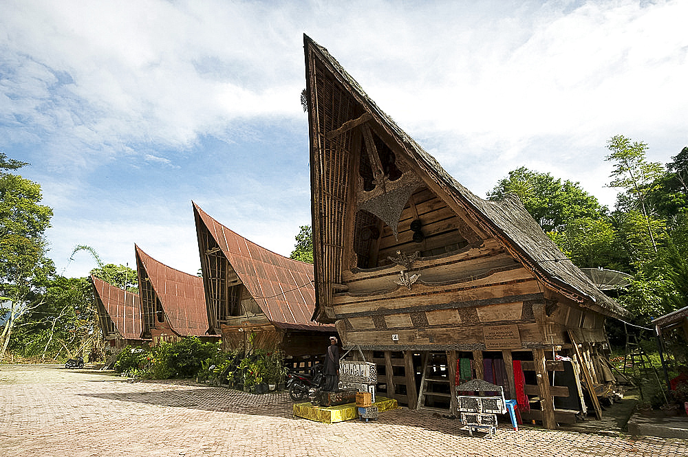 Batak Toba village houses with high ended roof and tribal carvings, Tomuk, Samosir Island, Sumatra, Indonesia, Southeast Asia, Asia