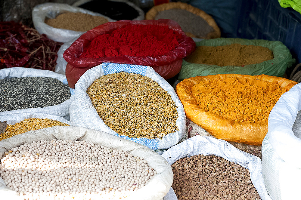 Pulses and spices in sacks for sale in Tizit village weekly local market, Nagaland, India, Asia