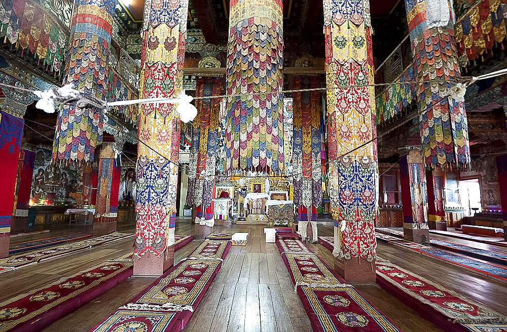 Prayer hall in Tawang Buddhist monastery, the largest in India, with pillars covered in prayer flags, Tawang, Arunachal Pradesh, India, Asia