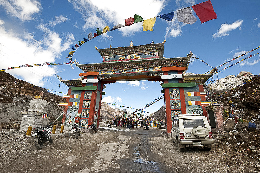 Buddhist prayer flags around the gate to Sela mountain pass at 13700 feet above sea level, Arunachal Pradesh, India, Asia