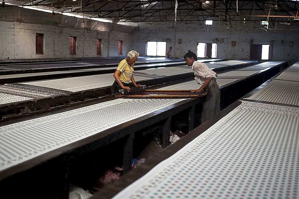 Men screenprinting sari lengths of cotton, Bhuj district, Gujarat, India, Asia