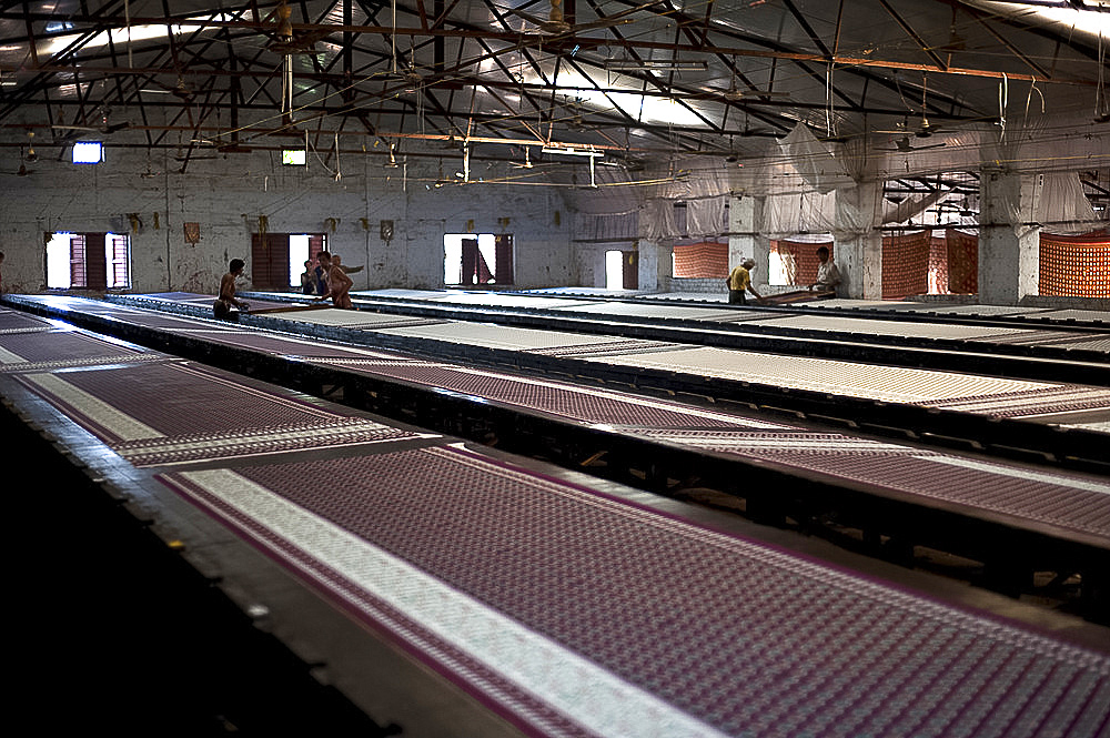 Screenprinting factory, men printing sari lengths of cotton by hand, Bhuj district, Gujarat, India, Asia