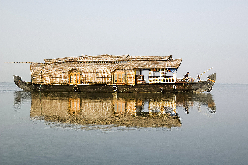 Kettuvallum (houseboat) on lagoon in backwaters, Kumarakom, Kerala, India