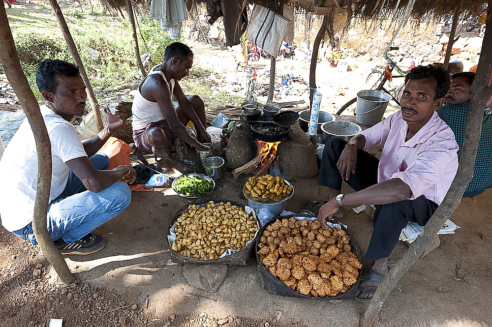 Bhaji and savoury snack stall in Mali weekly tribal market, Guneipada, Koraput district, Orissa (Odisha), India, Asia