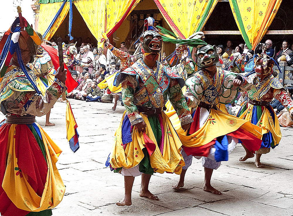 Monks in costume and animal masks performing ceremonial dance at Paro Tsechu (annual festival), Paro Dzong (monastery), Paro, Bhutan, Asia