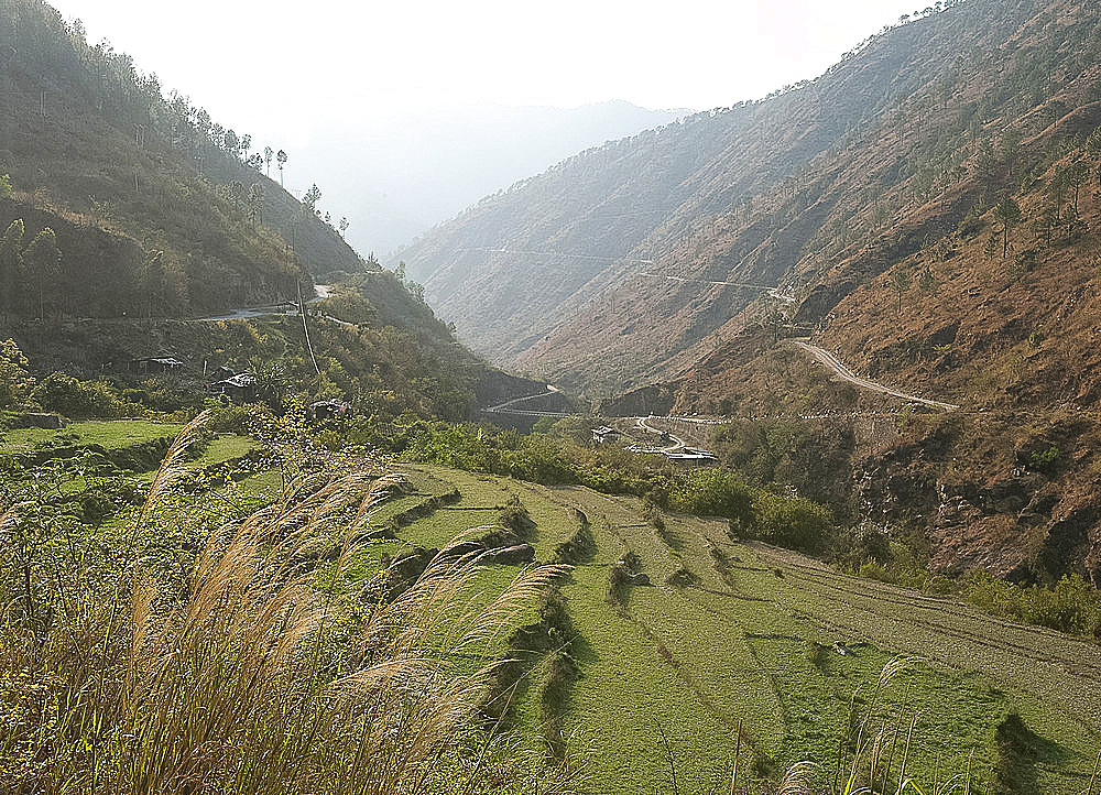 Gamri Chhu River running through the Trashigang Valley past terraced hills of rice fields, Eastern Bhutan, Asia