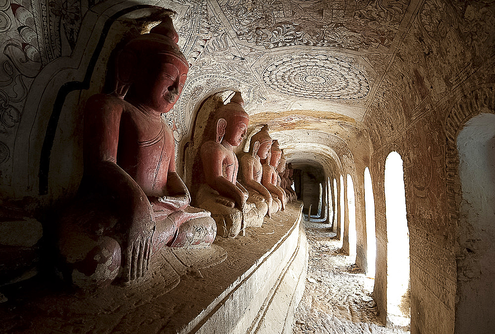 Buddha statues in one of the 947 Hpowindaung sandstone caves, 18th century paintings on the walls, Monywa, Sagaing District, Myanmar (Burma), Asia