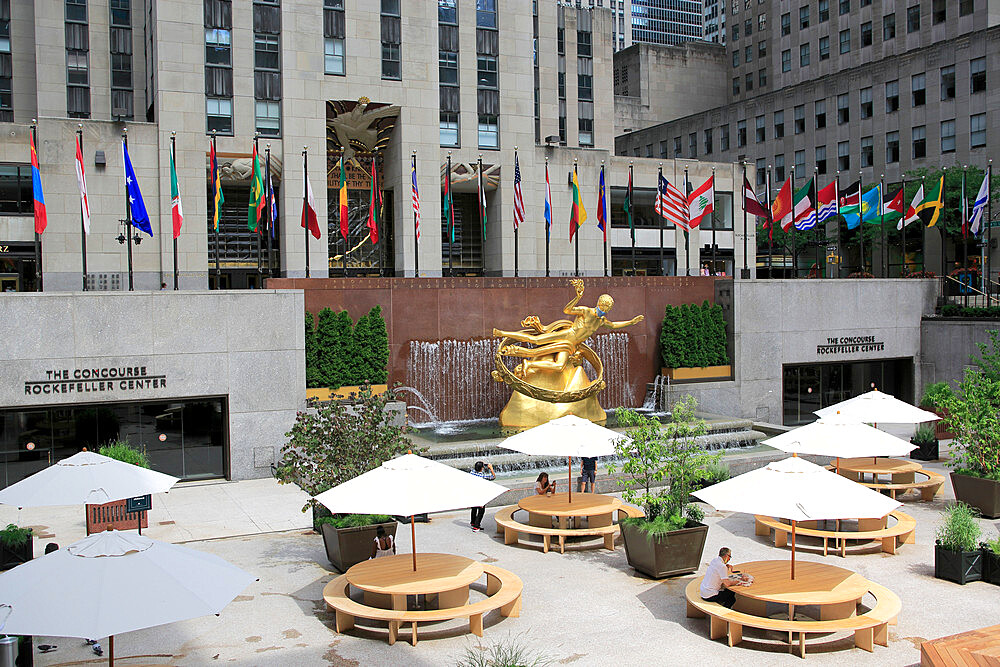 Prometheus Statue wearing mask during Coronavirus, Covid-19 Pandemic, Rockefeller Center, Plaza, Manhattan, New York City, United States of America, North America