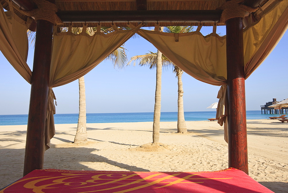 Four poster sunlounger on Jumeirah Beach and the Burj Al Arab Hotel, Jumeirah Beach, Dubai, United Arab Emirates, Middle East