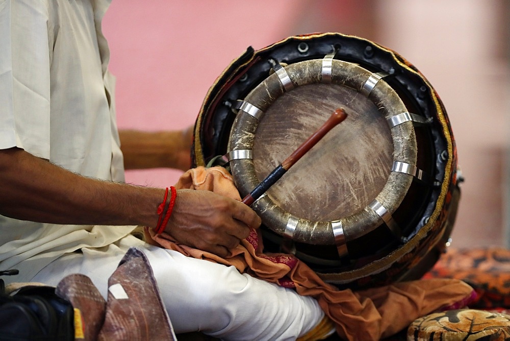 Musician playing a Thavil, a traditional Indian drum, Sri Mahamariamman Hindu Temple, Kuala Lumpur. Malaysia, Southeast Asia, Asia