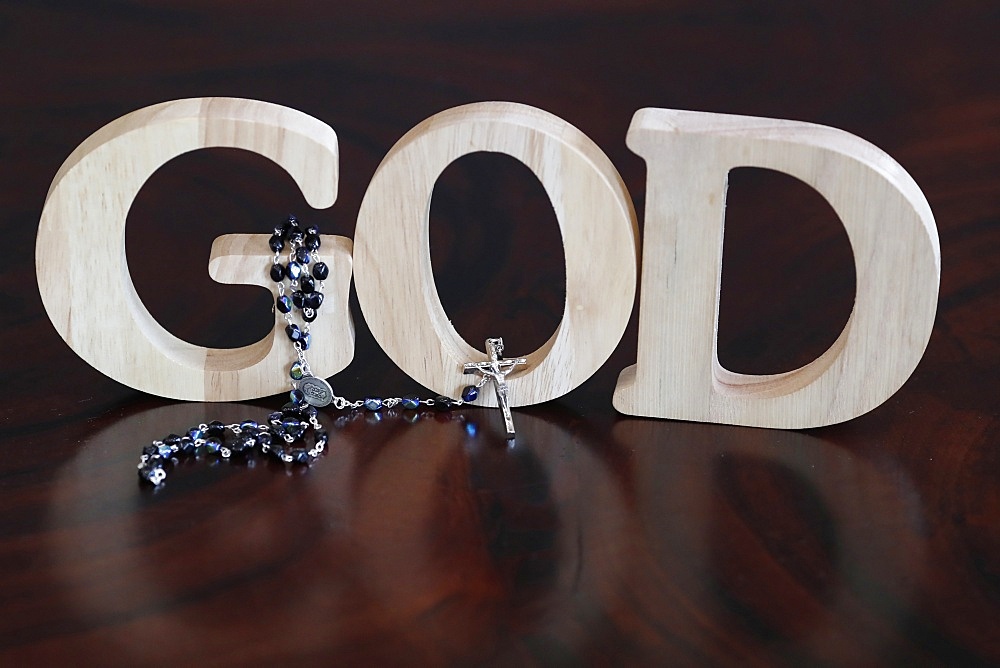 Wooden letters forming the word GOD and Rosary, Christian symbol, Vietnam, Indochina, Southeast Asia, Asia