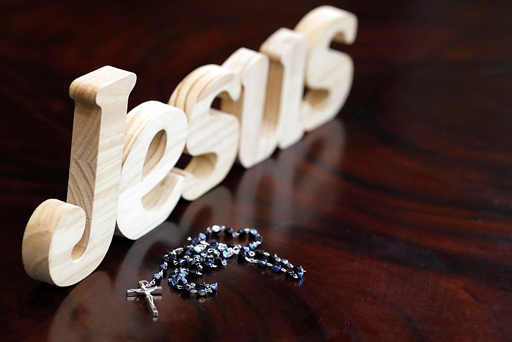 Wooden letters forming the word JESUS and Rosary, Christian symbol, Vietnam, Indochina, Southeast Asia, Asia