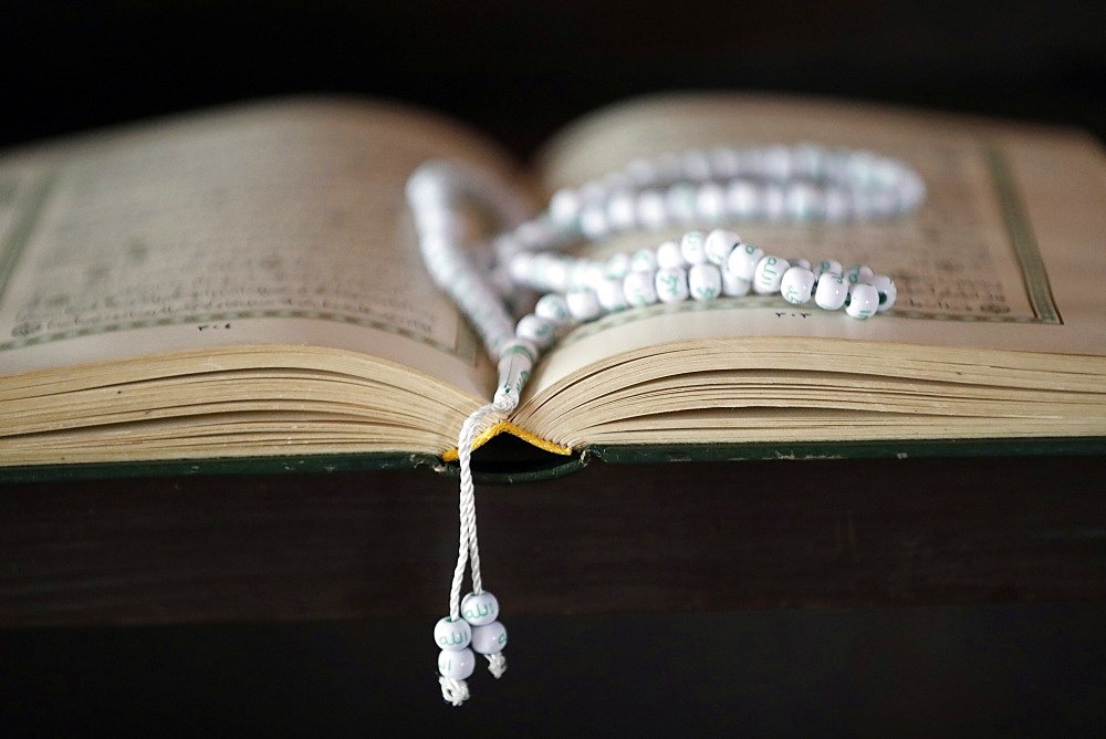 Open Quran and Islamic prayer beads (misbaha), Putra Mosque (Masjid Putra), Putrajaya, Malaysia, Southeast Asia, Asia