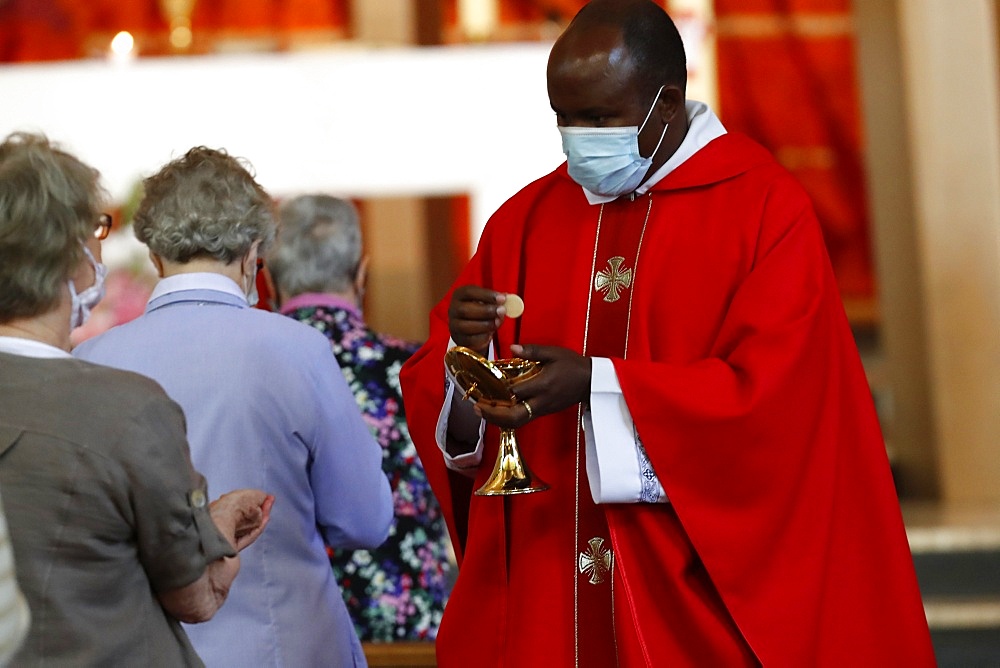 Coronavirus epidemic (Covid-19), Celebration of the Pentecost Mass after lockdown, Holy Communion, Saint Louis de Novel Church, Annecy, Haute Savoie, France, Europe