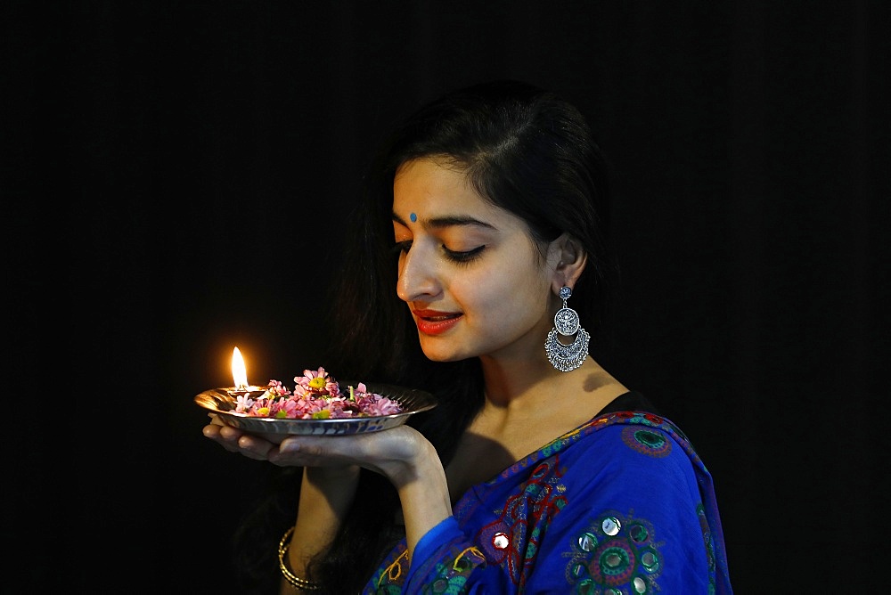 Indian dancer holding a Diwali tray, Paris, France, Europe