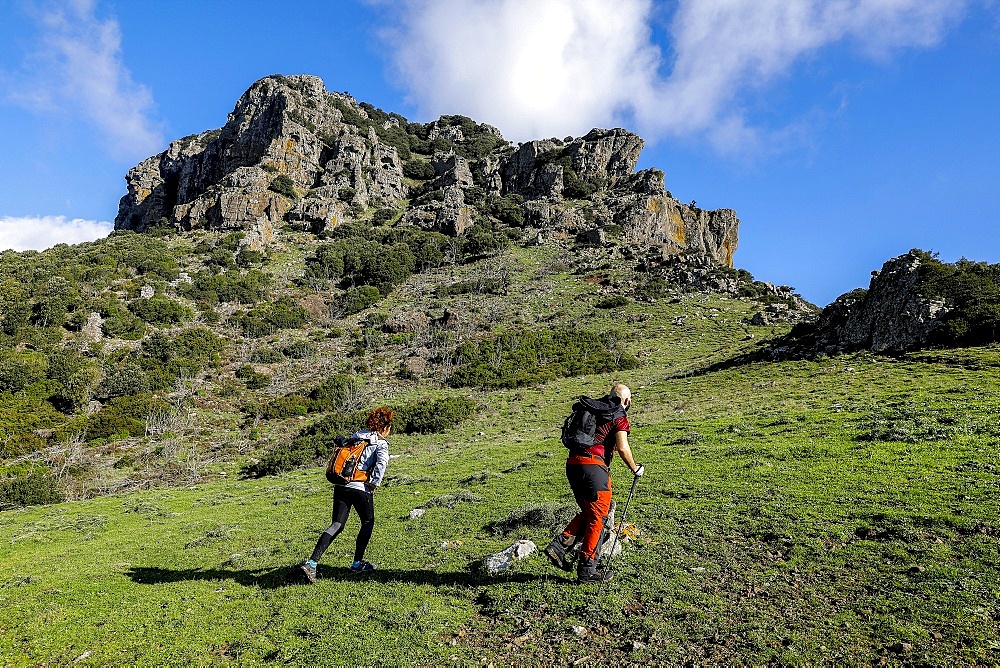 Trekkers on Arcuentu mountain, Sardinia, Italy, Europe