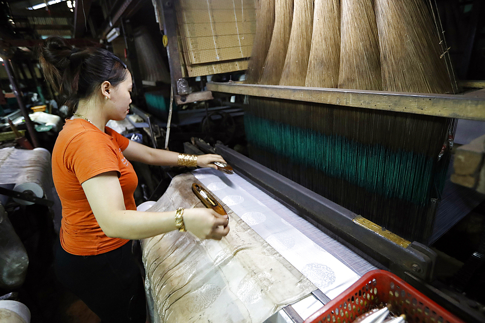 A traditional silk factory, woman working on an old silk loom, Tan Chau, Vietnam, Indochina, Southeast Asia, Asia