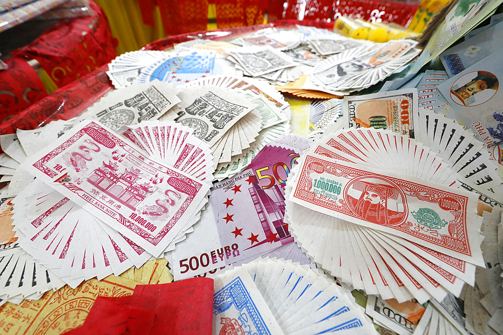 Burning hell bank notes and other forms of joss paper for Buddhist and Taoist ceremony, Phuoc Long Buddhist Temple, Tan Chau, Vietnam, Indochina, Southeast Asia, Asia