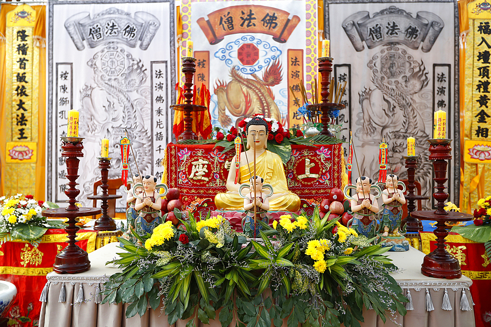 Buddha sitting in the meditation pose and Altar, Phuoc Long Buddhist Temple, Tan Chau, Vietnam, Indochina, Southeast Asia, Asia