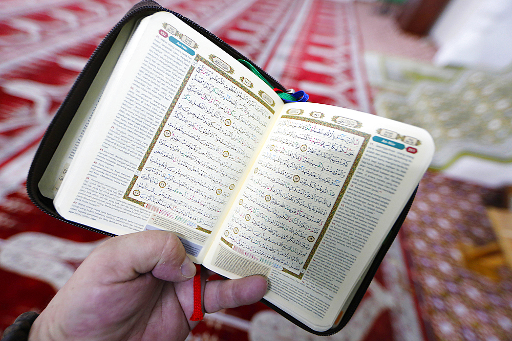 Man reading the Quran in a Mosque, close-up on the Holy Book, Ho Chi Minh City, Vietnam, Indochina, Southeast Asia, Asia