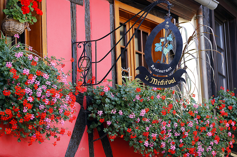 Restaurant sign in the village of Riquewihr, in the Alsace wine region of France, Alsace, France, Europe