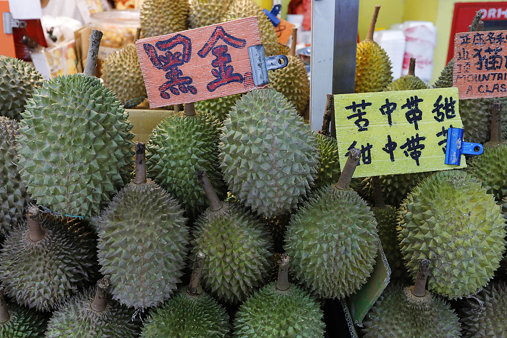 Durians for sale on a small street fruit market in Chinatown, Singapore, Southeast Asia, Asia