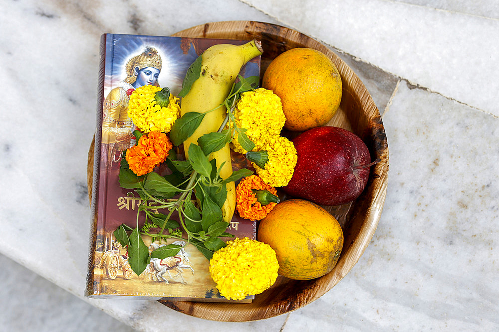 Offerings at ISKCON temple, flowers, fruit and Bhagavad Gita in Juhu, Mumbai, India, Asia