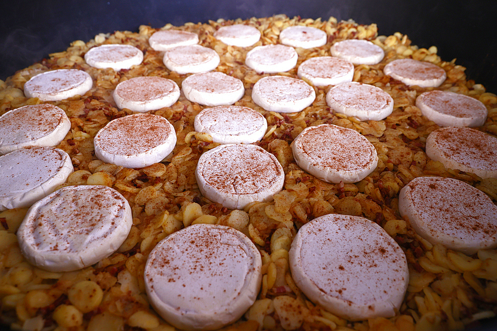 Giant fresh tartiflette, made with Roblochon cheese, potatoes and ham, a speciality in the French Alpes, Saint Gervais, Haute-Savoie, France, Europe