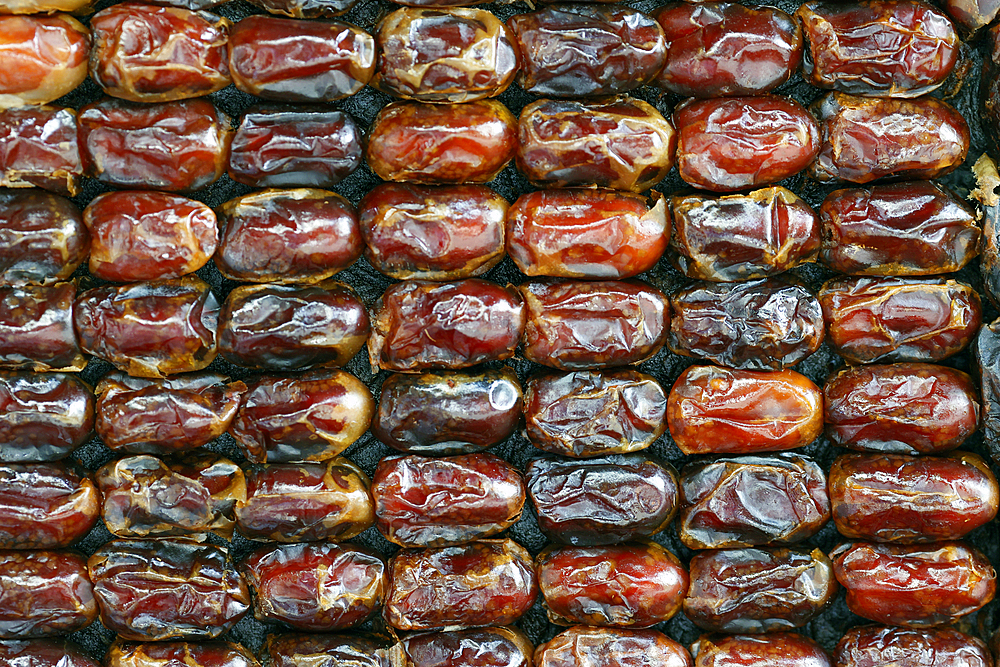 Special food for ramadan. Dates (date palm fruits) displayed on the food market.. Surabaya. Indonesia.