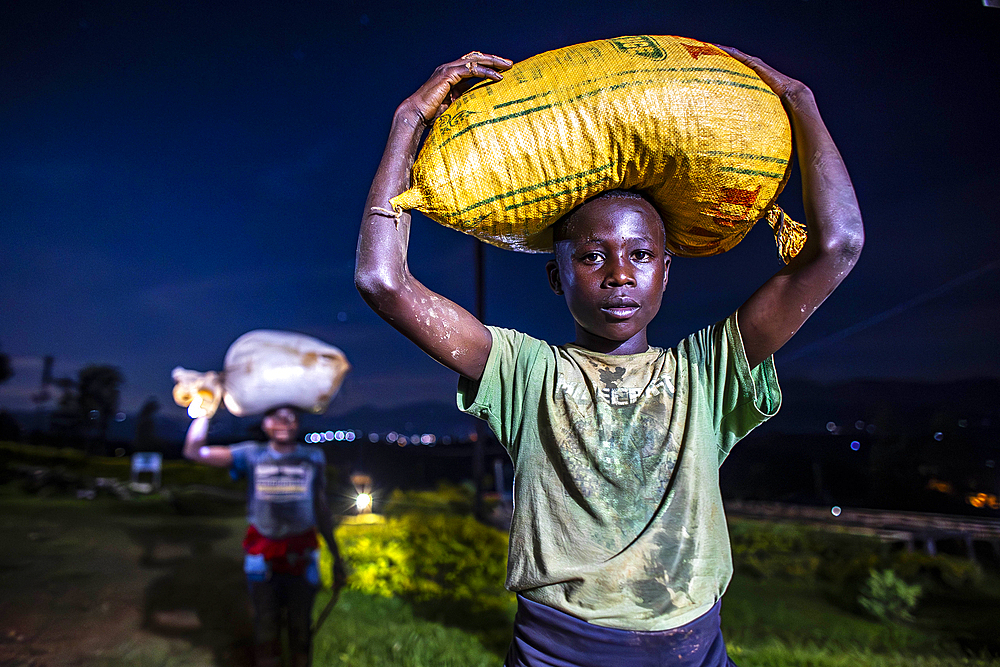 Children bringing coffee cherries to a coffee washing station, Rutsiro district, Northern province, Rwanda