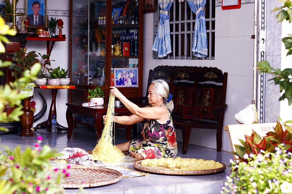 Senior woman making fresh noodles at home, An Giang Province, Mekong Delta, Vietnam, Indochina, Southeast Asia, Asia, Asia