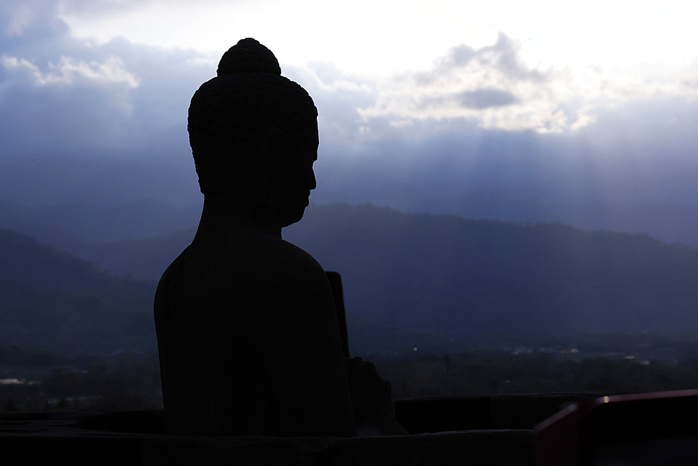 Borobudur, 9th-century Mahayana Buddhist temple. UNESCO World Heritage. Stone Buddha statue. Java. Indonesia.