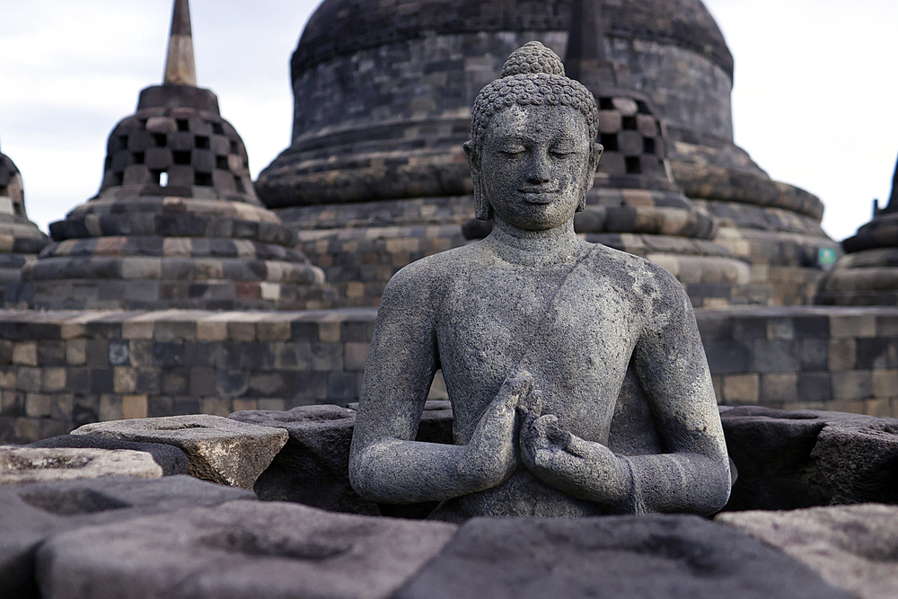 Borobudur, 9th-century Mahayana Buddhist temple. UNESCO World Heritage. Stone Buddha statue. Java. Indonesia.