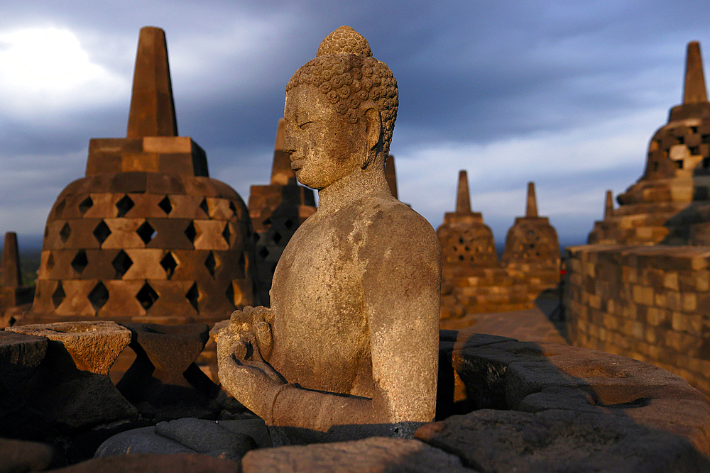 Borobudur, 9th-century Mahayana Buddhist temple. UNESCO World Heritage. Stone Buddha statue. Java. Indonesia.