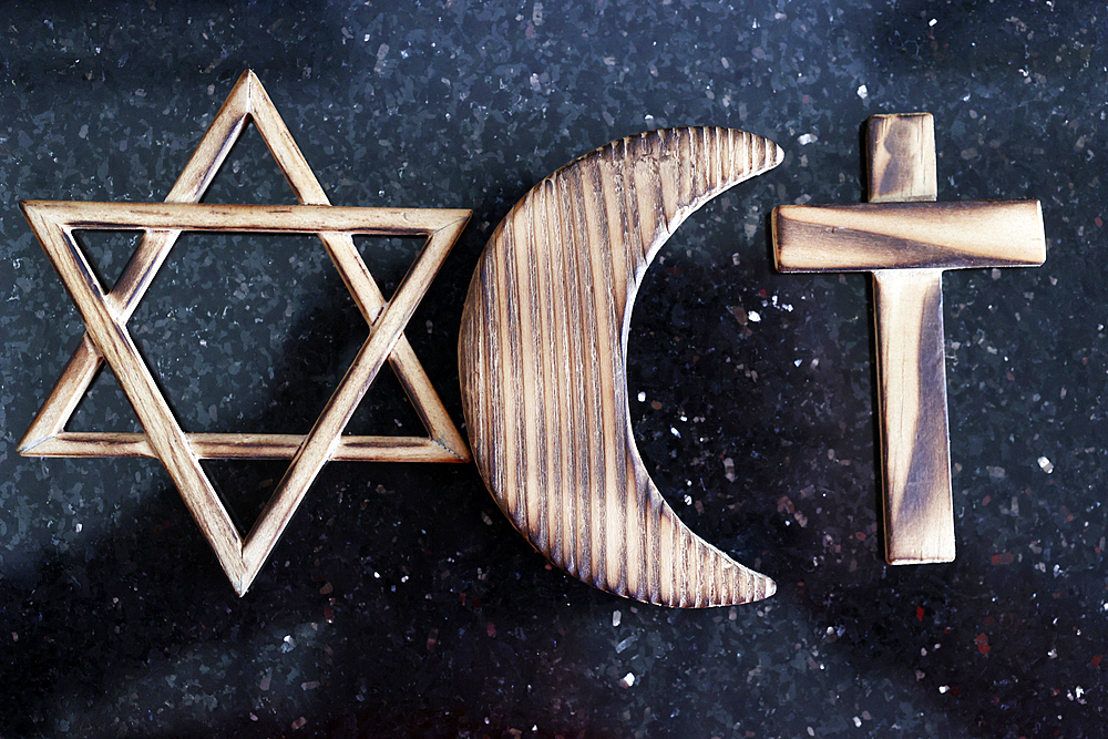 Christianity, Islam and Judaism : the three monotheistic religions. Jewish Star, Christian Cross and Muslim Crescent. Interreligious and interfaith dialogue.