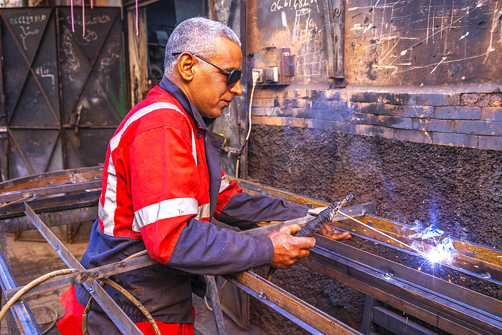 Welder at work in a workshop in Marrakesh, Morocco