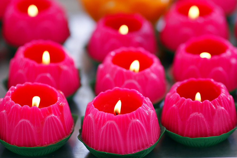 Pink lotus flowers candles at the Thean Hou Temple. Lotus flower is the symbol of human growth and development. Kuala Lumpur. Malaysia.