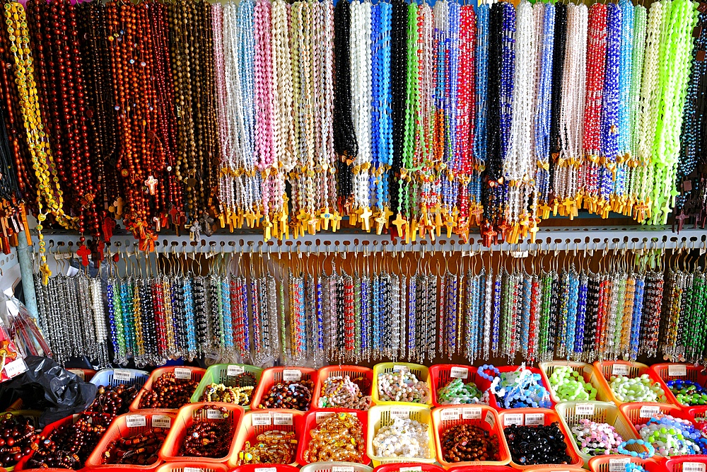 Shop selling religious christian items. Rosary prayer beads for sale. Ho Chi Minh City. Vietnam.