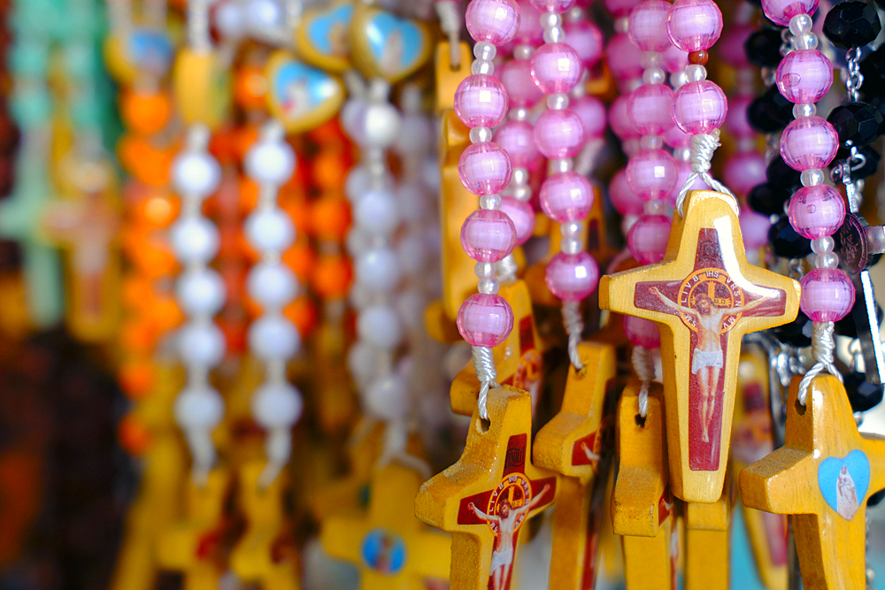 Shop selling religious christian items. Rosary prayer beads for sale. Ho Chi Minh City. Vietnam.