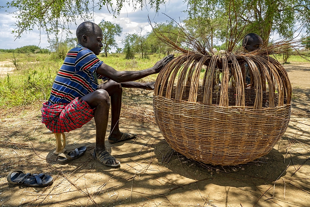 Making a rattan case in Loluk village, Napak district, Karamoja, Uganda