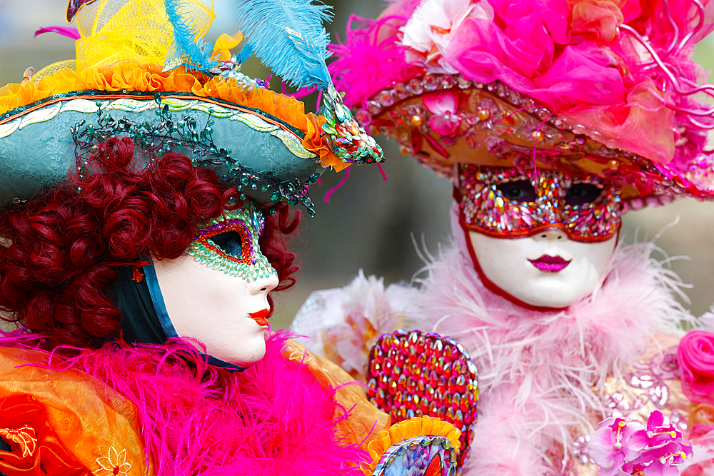 Women wearing traditional mask and costume. Annual venetian carnival of Annecy, Haute Savoie, France.