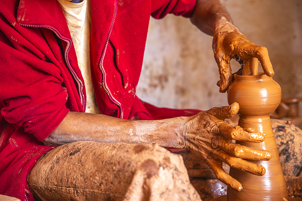 Potter at work in a workshop, Safi, Morocco