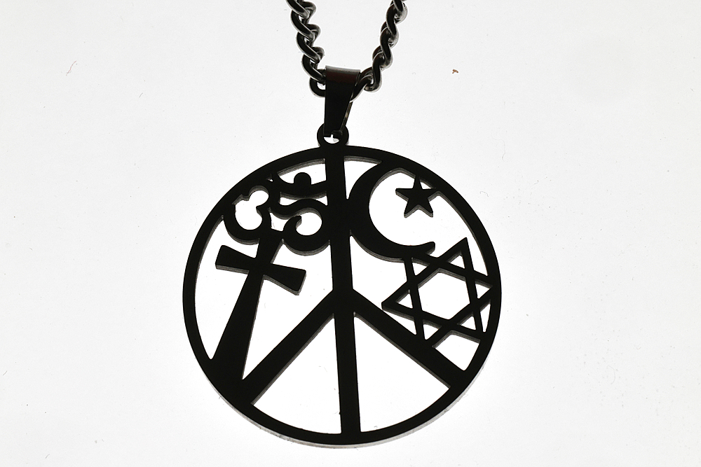Pendant with symbols of major religions. Christianity, Judaism, Hinduism. Cross, Star of David, crescent and Om. Symbol of peace and interfaith dialogue.