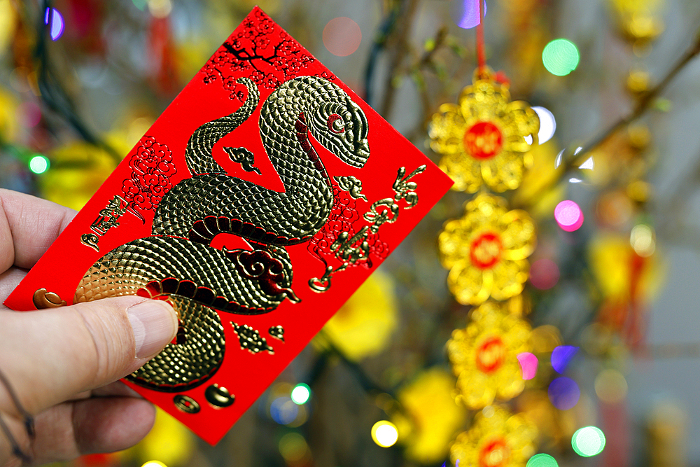 Red envelopes ( hongbao ) for Chinese and Vietnamese New Year celebration. Red color is a symbol of good luck.