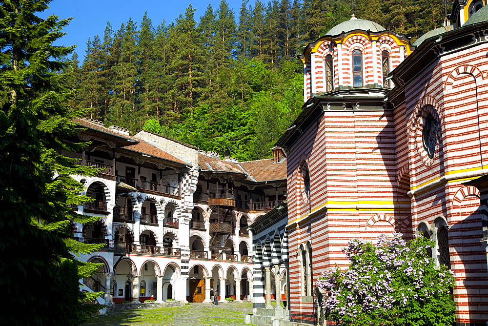 Courtyard, dormitories and Church of the Nativity, Rila Monastery, UNESCO World Heritage Site, nestled in the Rila Mountains, Bulgaria, Europe