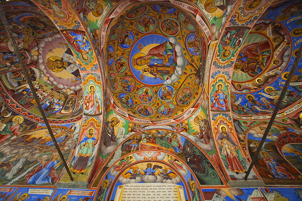 Arcade murals depicting religious figures and scenes, Church of the Nativity, Rila Monastery, UNESCO World Heritage Site, Bulgaria, Europe