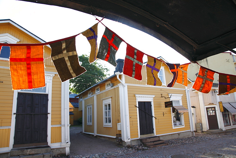 Decorative flags and medieval wooden houses, Porvoo, Uusimaa, Finland, Scandinavia, Europe